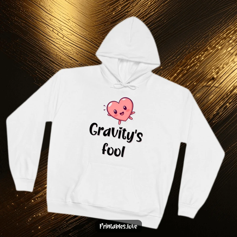 Funny tumbling heart character hoodie, expressing surprise while falling head over heels, offering warmth and a humorous design.