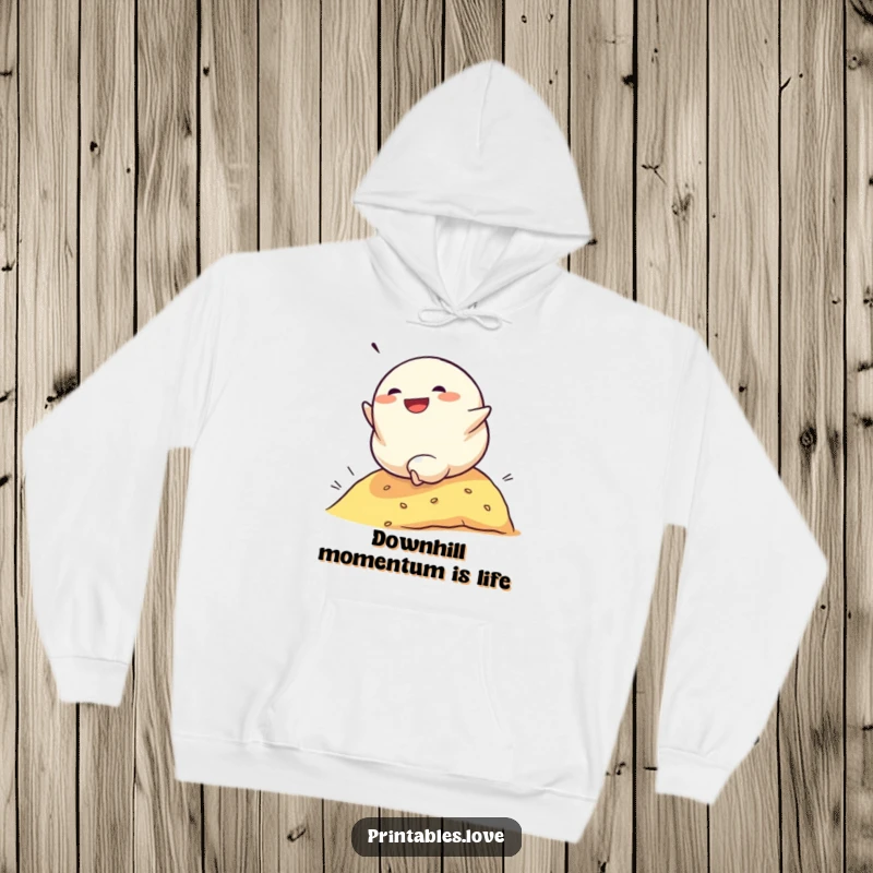 Funny hoodie featuring a determined dumpling character rolling down a hill with glee, a cozy and humorous garment for adventurers.