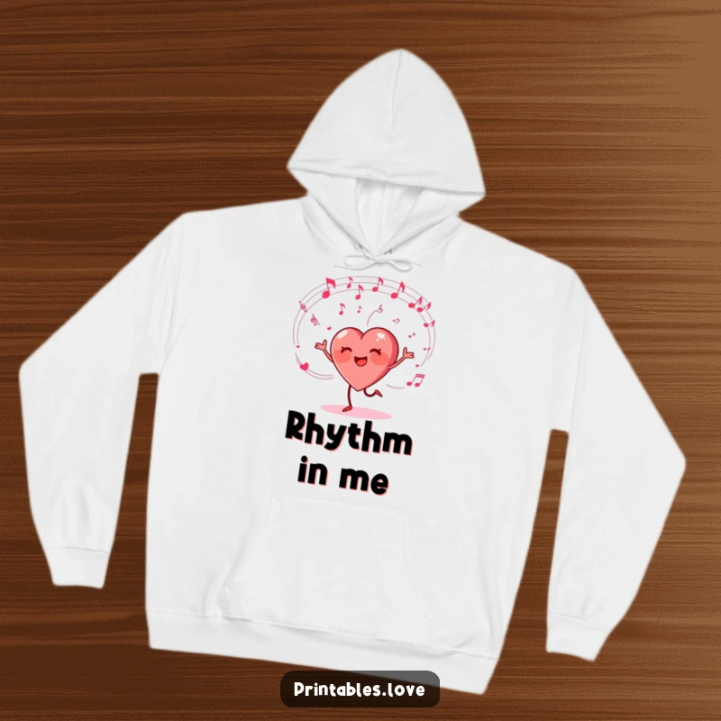 Funny hoodie with a heart character happily dancing amidst swirling musical notes, offering cozy comfort and musical humor.