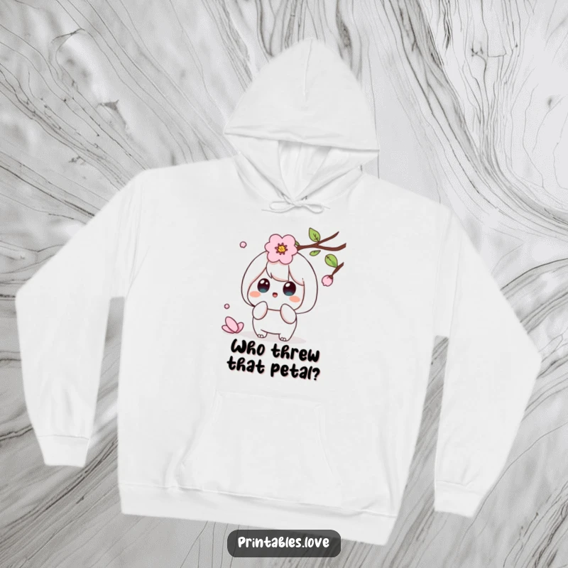 Funny Kawaii hoodie showing a cute character with a surprised expression as a cherry blossom petal descends.
